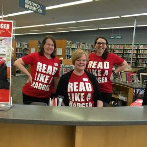 Pinney Librarians show off their summer reading spirit at the reference desk