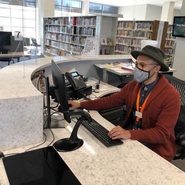 librarian Dominic Davis at the Pinney Reference Desk 